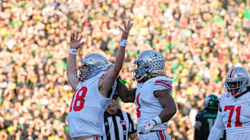 Oct 12, 2024; Eugene, Oregon, USA; Ohio State Buckeyes quarterback Will Howard (18) celebrates scoring a touchdown during the first half of the NCAA football game against the Oregon Ducks at Autzen Stadium