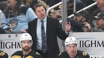 Mar 1, 2025; Pittsburgh, Pennsylvania, USA;  Boston Bruins interim head coach Joe Sacco (rear) reacts on the bench against the Pittsburgh Penguins during the third period at PPG Paints Arena. Mandatory Credit: Charles LeClaire-Imagn Images
