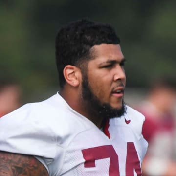 The Crimson Tide football team continued practice Thursday, Aug. 1, 2024, as they prepare for the season opener and the first game under new head coach Kalen DeBoer. Alabama offensive lineman Kadyn Proctor (74) cools off between drills.