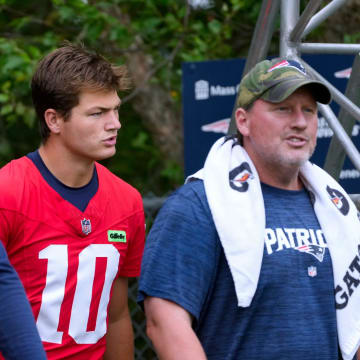 Patriots quarterback Drake Maye heads out to the field on the first day of training camp Wednesday morning.