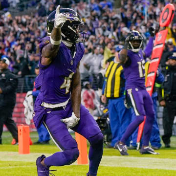 Dec 10, 2023; Baltimore, Maryland, USA;  Baltimore Ravens wide receiver Zay Flowers (4) celebrates his touchdown during the fourth quarter against the Los Angeles Rams at M&T Bank Stadium. Mandatory Credit: Jessica Rapfogel-USA TODAY Sports