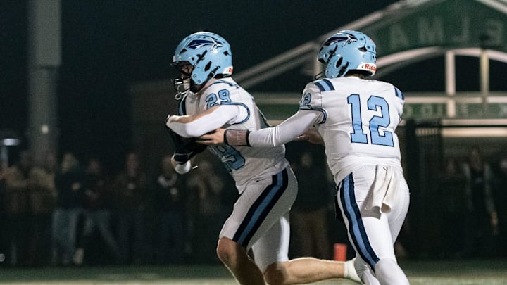 North Penn quarterback Matt Bucksar hands off to running back Matthew Pownall in the PIAA District One Class 6A championship football game against Pennridge, Friday, Nov. 21, 2025, at Helman Field in Perkasie. The Knights clinched the district title with a 21-14 win over the Rams.