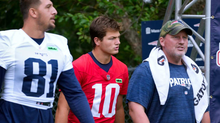 Patriots quarterback Drake Maye heads out to the field on the first day of training camp Wednesday morning.