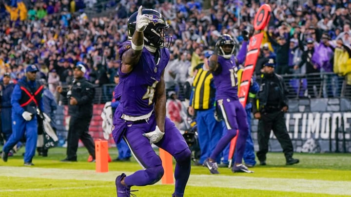 Dec 10, 2023; Baltimore, Maryland, USA;  Baltimore Ravens wide receiver Zay Flowers (4) celebrates his touchdown during the fourth quarter against the Los Angeles Rams at M&T Bank Stadium. Mandatory Credit: Jessica Rapfogel-USA TODAY Sports
