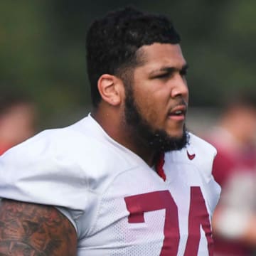 The Crimson Tide football team continued practice Thursday, Aug. 1, 2024, as they prepare for the season opener and the first game under new head coach Kalen DeBoer. Alabama offensive lineman Kadyn Proctor (74) cools off between drills.