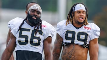 Jul 30, 2025; New Orleans, LA, USA;  New Orleans Saints linebacker Demario Davis (56) and defensive end Chase Young (99) during training camp at Ochsner Sports Performance Center. Mandatory Credit: Stephen Lew-Imagn Images