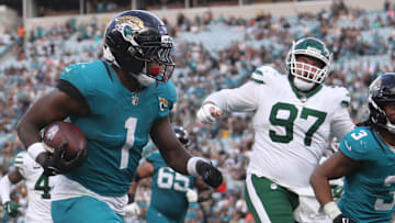 Dec 14, 2025; Jacksonville, Florida, USA; Jacksonville Jaguars running back Travis Etienne Jr. (1) runs to score a touchdown during the fourth quarter against the New York Jets at EverBank Stadium. Mandatory Credit: Morgan Tencza-Imagn Images