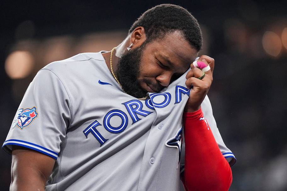 Vladimir Guerrero Jr. wipes his face