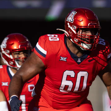 Nov 30, 2024; Tucson, Arizona, USA; Arizona Wildcats offensive lineman Alexander Doost (60) against the Arizona State Sun Devils during the Territorial Cup at Arizona Stadium. Mandatory Credit: Mark J. Rebilas-Imagn Images