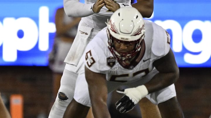 Sep 28, 2024; Dallas, Texas, USA; Florida State Seminoles quarterback DJ Uiagalelei (4) and offensive lineman Maurice Smith (53) in action during the game between the Southern Methodist Mustangs and the Florida State Seminoles at Gerald J. Ford Stadium. Mandatory Credit: Jerome Miron-Imagn Images