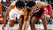 Texas Longhorns guard Tre Johnson (20) battles Arkansas Razorbacks forward Karter Knox (11) for a loose ball in the first half as the Longhorns take on the Razorbacks at the Moody Center, Feb. 5, 2025. Arkansas won the game 78-70.