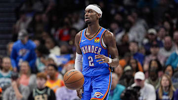 Nov 15, 2025; Charlotte, North Carolina, USA; Oklahoma City Thunder guard Shai Gilgeous-Alexander (2) brings the ball up court against the Charlotte Hornets during the second half at Spectrum Center. Mandatory Credit: Jim Dedmon-Imagn Images