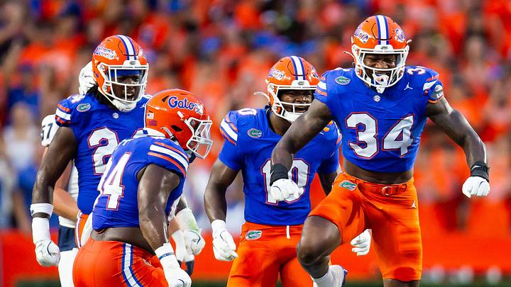 Florida Gators edge George Gumbs Jr. (34) celebrates tackling Samford Bulldogs wide receiver E. Jai Mason (3) during the first half at Ben Hill Griffin Stadium in Gainesville, FL on Saturday, September 7, 2024 against the Samford Bulldogs. [Doug Engle/Gainesville Sun]