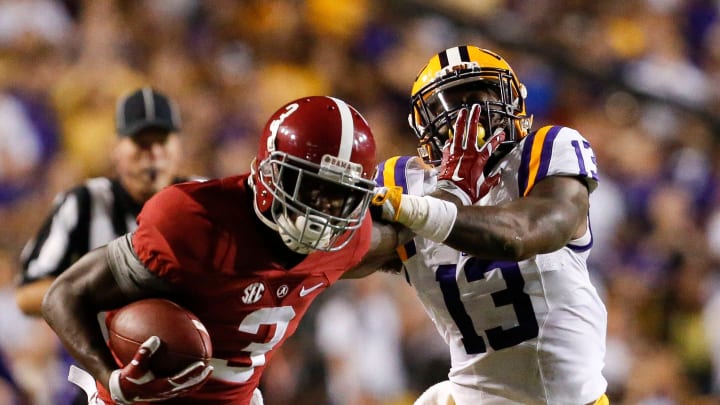 Alabama wide receiver Calvin Ridley (3) stiff arms LSU defensive back Dwayne Thomas (13) as he runs up the sidelines during the first half of Alabama's game with LSU in Tiger Stadium Saturday, November 5, 2016.