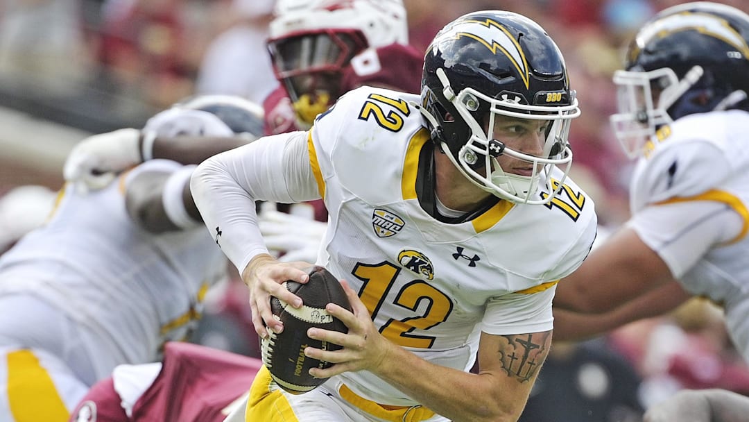 Sep 20, 2025; Tallahassee, Florida, USA; Kent State Golden Flashes quarterback Dru DeShields (12) scrambles out of the pocket during the first half against the Florida State Seminoles at Doak S. Campbell Stadium. Mandatory Credit: Melina Myers-Imagn Images
