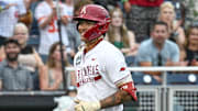 Arkansas Razorbacks shortstop Wehiwa Aloy (9) circles the bases after hitting a home run against the UCLA Bruins during the first inning at Charles Schwab Field. 