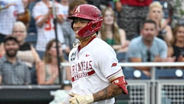 Arkansas Razorbacks shortstop Wehiwa Aloy (9) circles the bases after hitting a home run against the UCLA Bruins during the first inning at Charles Schwab Field. 