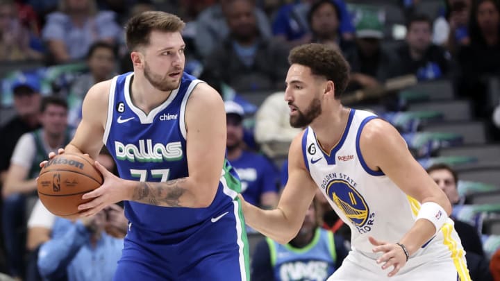 Nov 29, 2022; Dallas, Texas, USA;  Dallas Mavericks guard Luka Doncic (77) controls the ball as Golden State Warriors guard Klay Thompson (11) defends during the first quarter at American Airlines Center. Mandatory Credit: Kevin Jairaj-USA TODAY Sports