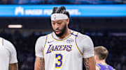 Dec 21, 2024; Sacramento, California, USA; Los Angeles Lakers guard D'Angelo Russell (1) high fives forward Anthony Davis (3) after scoring against the Sacramento Kings during the second quarter at Golden 1 Center. Mandatory Credit: Ed Szczepanski-Imagn Images