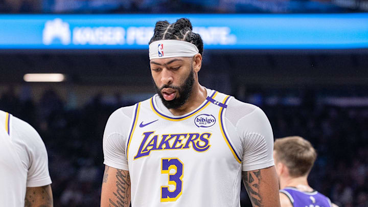 Dec 21, 2024; Sacramento, California, USA; Los Angeles Lakers guard D'Angelo Russell (1) high fives forward Anthony Davis (3) after scoring against the Sacramento Kings during the second quarter at Golden 1 Center. Mandatory Credit: Ed Szczepanski-Imagn Images