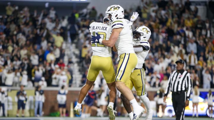 Nov 18, 2023; Atlanta, Georgia, USA; Georgia Tech Yellow Jackets wide receiver Dominick Blaylock (12) celebrates after a touchdown with tight end Dylan Leonard (2) and running back Jamal Haynes (11) against the Syracuse Orange in the first half at Bobby Dodd Stadium at Hyundai Field. Mandatory Credit: Brett Davis-USA TODAY Sports