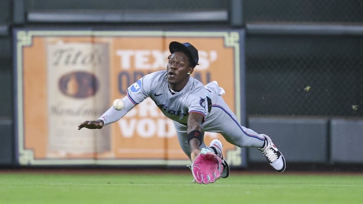 Jul 10, 2024; Houston, Texas, USA; Miami Marlins center fielder Jazz Chisholm Jr (2) dives but is unable to catch a fly ball during the first inning against the Houston Astros at Minute Maid Park. Mandatory Credit: Troy Taormina-USA TODAY Sports