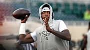 Michigan State's Aidan Chiles warms up before the football game against Western Michigan on Friday, Aug. 29, 2025, in East Lansing.