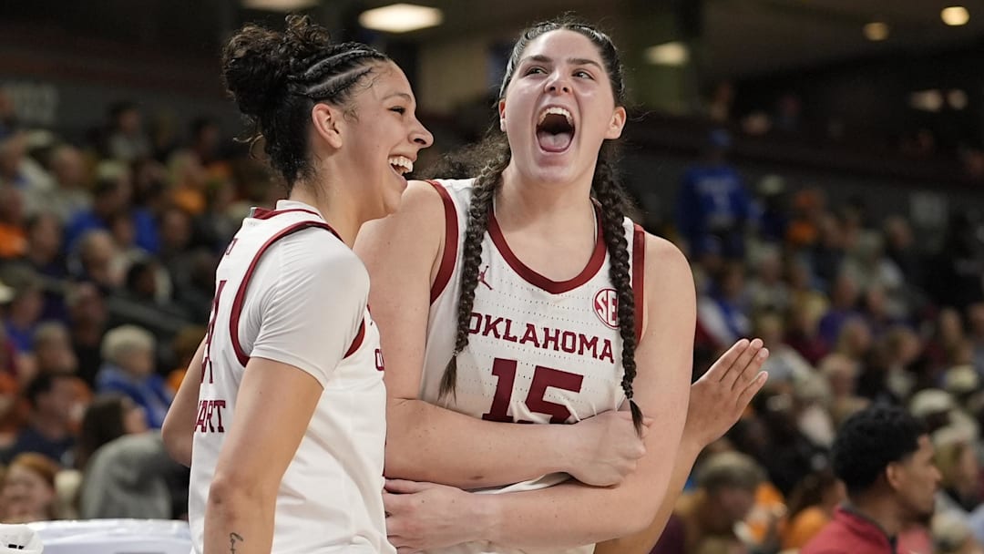 Oklahoma's Brooklyn Stewart, left, and Raegan Beers celebrate a play against the Florida Gators during the first half at Bon Secours Wellness Arena. 