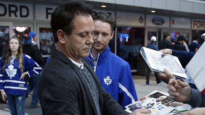 Oct 7, 2015; Toronto, Ontario, CAN; Toronto Maple Leafs former player Doug Gilmour signs autographs outside of the Air Canada Centre prior to the home opener against the Montreal Canadiens. Mandatory Credit: John E. Sokolowski-Imagn Images