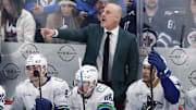 Mar 30, 2025; Winnipeg, Manitoba, CAN; Vancouver Canucks head coach Rick Tocchet gestures during a game against the Winnipeg Jets in the third period at Canada Life Centre. Mandatory Credit: James Carey Lauder-Imagn Images