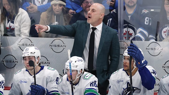 Mar 30, 2025; Winnipeg, Manitoba, CAN; Vancouver Canucks head coach Rick Tocchet gestures during a game against the Winnipeg Jets in the third period at Canada Life Centre. Mandatory Credit: James Carey Lauder-Imagn Images