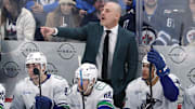 Mar 30, 2025; Winnipeg, Manitoba, CAN; Vancouver Canucks head coach Rick Tocchet gestures during a game against the Winnipeg Jets in the third period at Canada Life Centre. Mandatory Credit: James Carey Lauder-Imagn Images