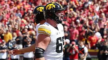 Sep 6, 2025; Ames, Iowa, USA; Iowa Hawkeyes offensive lineman Logan Jones (65) reacts after a play against the Iowa State Cyclones during the second half at Jack Trice Stadium. Mandatory Credit: Reese Strickland-Imagn Images