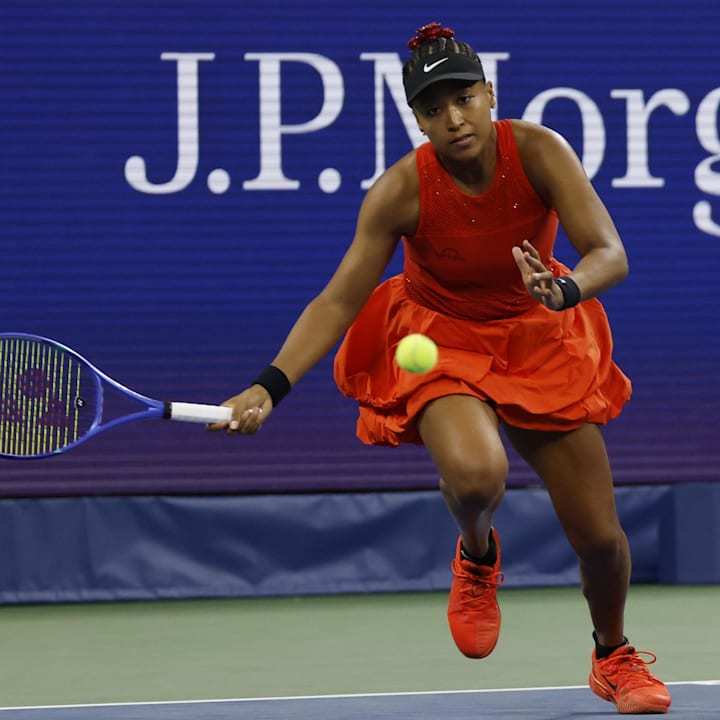 Naomi Osaka chases a shot from Greet Minnen on Day 3 of the 2025 US Open