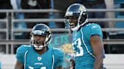 Dec 12, 2010; Jacksonville, FL, USA; Jacksonville Jaguars receiver Mike Sims Walker (11) celebrates with receiver Jason Hill (83) after scoring on a 10-yard touchdown pass in the third quarter against the Oakland Raiders at EverBank Field. The Jaguars defeated the Raiders 38-31. Mandatory Credit: Kirby Lee/Image of Sport-Imagn Images