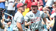 Jun 16, 2025; Omaha, Neb, USA;  Arkansas Razorbacks starting pitcher Gage Wood (14) celebrates with infielder Gabe Fraser (6) after throwing a no hitter against the Murray State Racers at Charles Schwab Field. Mandatory Credit: Steven Branscombe-Imagn Images