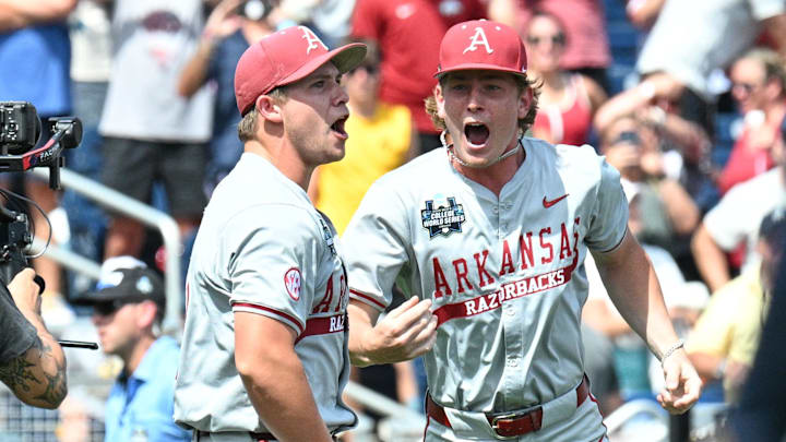 Jun 16, 2025; Omaha, Neb, USA; Arkansas Razorbacks starting pitcher Gage Wood (14) celebrates with infielder Gabe Fraser (6) after throwing a no hitter against the Murray State Racers at Charles Schwab Field. Jun 16, 2025; Omaha, Neb, USA; Arkansas Razorbacks starting pitcher Gage Wood (14) celebrates with infielder Gabe Fraser (6) after throwing a no hitter against the Murray State Racers at Charles Schwab Field.