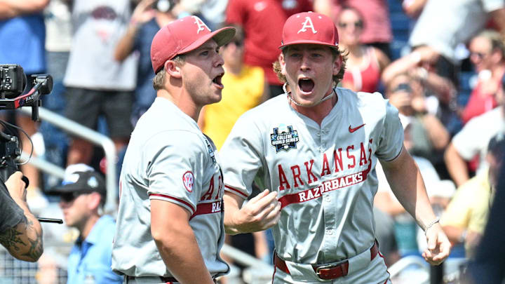 Jun 16, 2025; Omaha, Neb, USA;  Arkansas Razorbacks starting pitcher Gage Wood (14) celebrates with infielder Gabe Fraser (6) after throwing a no-hitter against the Murray State Racers at Charles Schwab Field. Mandatory Credit: Steven Branscombe-Imagn Images