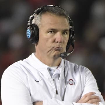 Expect the College Football Playoff to change to the SEC and Big Ten's liking, Urban Meyer predicts.