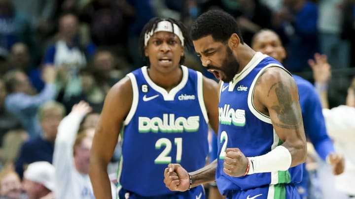 Feb 13, 2023; Dallas, Texas, USA;  Dallas Mavericks guard Kyrie Irving (2) celebrates with Dallas Mavericks guard Frank Ntilikina (21) during the fourth quarter against the Minnesota Timberwolves at American Airlines Center. Mandatory Credit: Kevin Jairaj-USA TODAY Sports