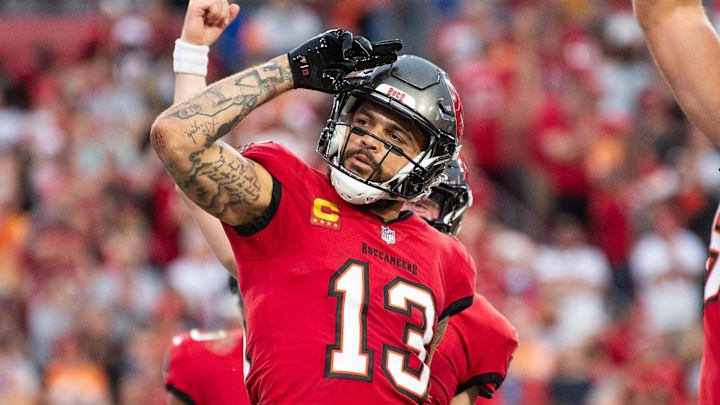 Dec 24, 2023; Tampa, Florida, USA; Tampa Bay Buccaneers wide receiver Mike Evans (13) celebrates the touchdown against the Jacksonville Jaguars in the second quarter at Raymond James Stadium. Mandatory Credit: Jeremy Reper-Imagn Images