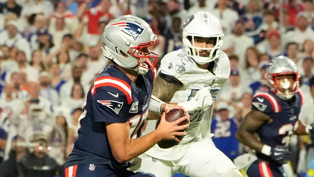 Oct 5, 2025; Orchard Park, New York, USA; New England Patriots quarterback Drake Maye (10) runs with the ball against the Buffalo Bills during the first half at Highmark Stadium. Mandatory Credit: Gregory Fisher-Imagn Images