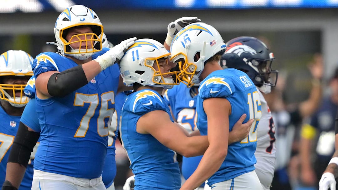 Los Angeles Chargers kicker Cameron Dicker is congratulated by offensive tackle Joe Alt and place holder J.K. Scott.