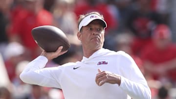 Oct 18, 2025; Athens, Georgia, USA; Mississippi Rebels head coach Lane Kiffin throws the ball prior to the game against the Georgia Bulldogs at Sanford Stadium. Mandatory Credit: Brett Davis-Imagn Images