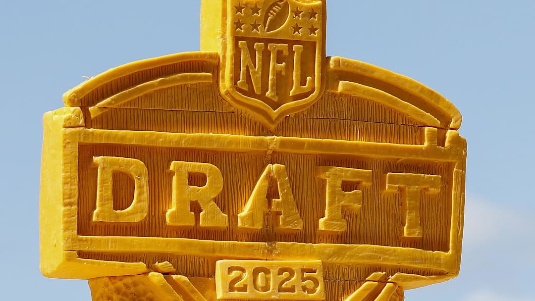 The 2025 NFL Draft logo is seen carved into blocks of cheese during the third day of the 2025 NFL Draft at Lambeau Field. 