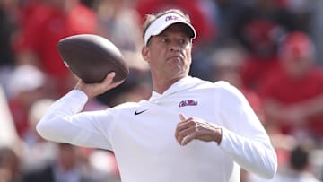 Oct 18, 2025; Athens, Georgia, USA; Mississippi Rebels head coach Lane Kiffin throws the ball prior to the game against the Georgia Bulldogs at Sanford Stadium. Mandatory Credit: Brett Davis-Imagn Images
