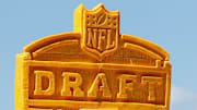 The 2025 NFL Draft logo is seen carved into blocks of cheese during the third and final day of the 2025 NFL Draft on Saturday, April 26, 2025, at Lambeau Field in Green Bay, Wisconsin. 