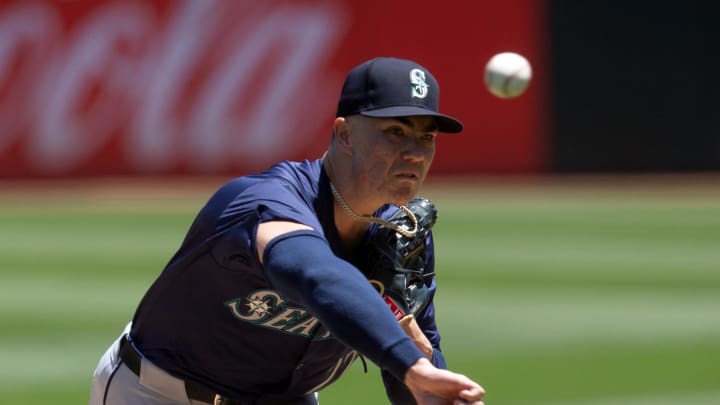 Seattle Mariners starting pitcher Bryan Woo (22) delivers a pitch against the Oakland Athletics during the first inning at Oakland-Alameda County Coliseum on June 6.