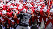 Oct 4, 2025; Raleigh, North Carolina, USA;  NC State Wolfpack head coach Dave Doeren with his team prepare to run out prior to the first half of the game against Campbell Fighting Camels at Carter-Finley Stadium. Mandatory Credit: Jaylynn Nash-Imagn Images