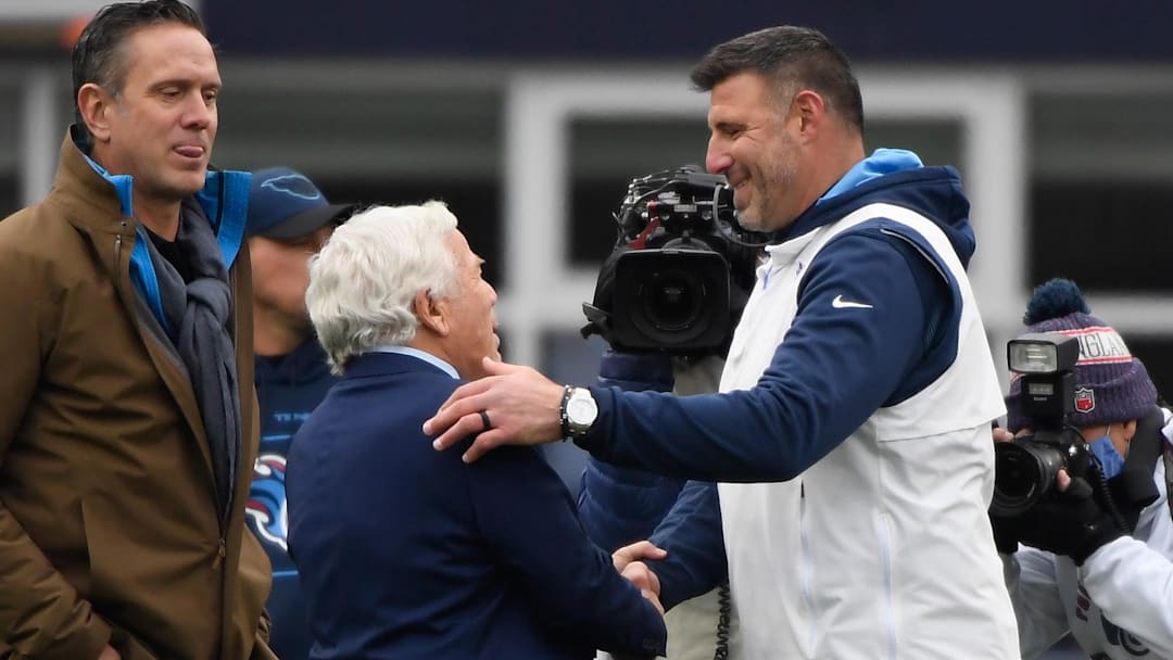 Nov 28, 2021; Foxborough, Massachusetts, USA;  Tennessee Titans head coach Mike Vrabel shakes the hand of New England Patriots owner Robert Kraft while former Patriots quarterback looks on during pregame at Gillette Stadium. Mandatory Credit: Bob DeChiara-Imagn Images
